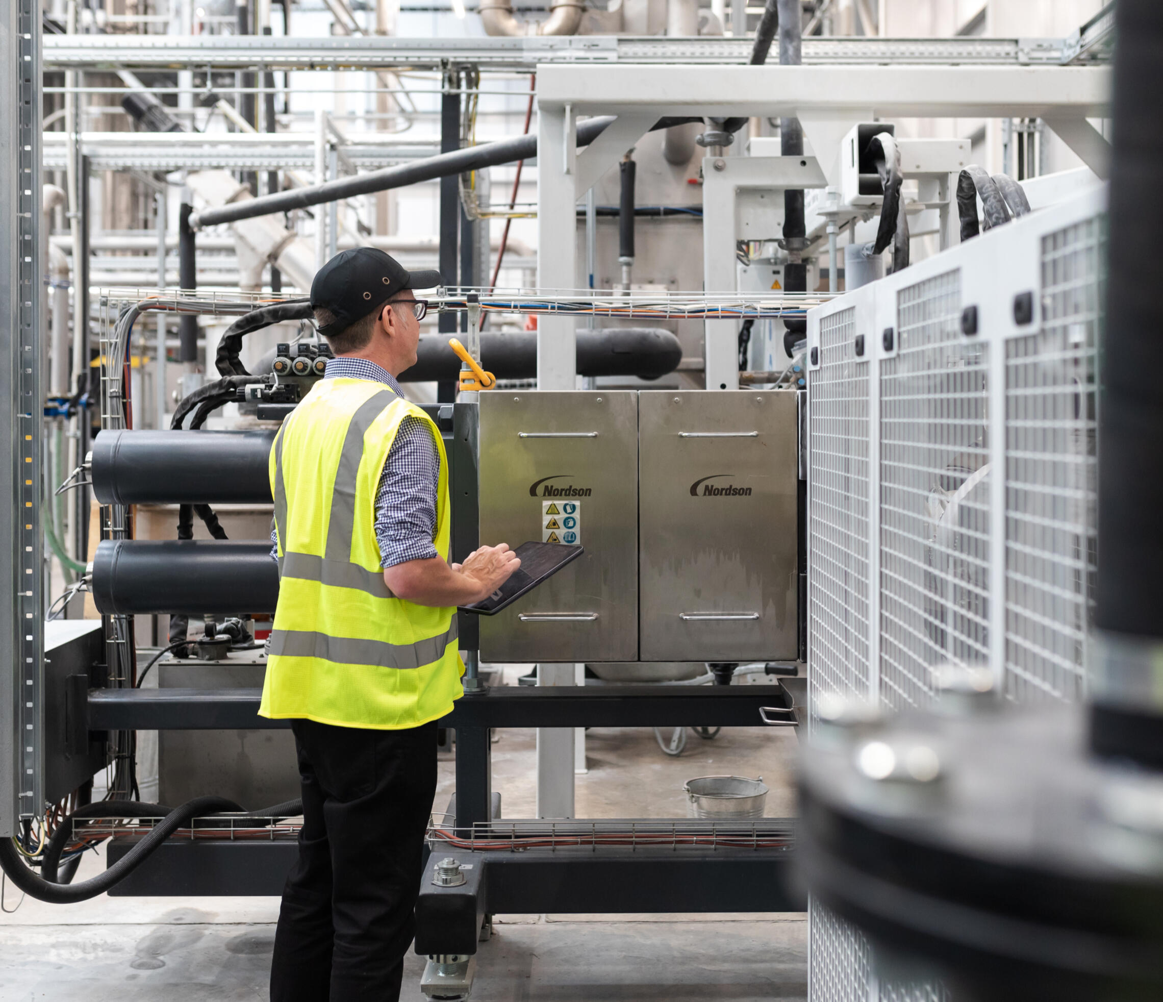 David Bargery from Regis Machinery inspecting Nordson equipment